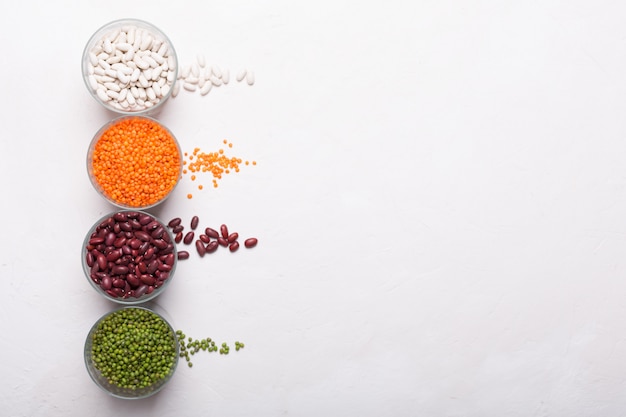 Lentils in glasses on the table. This legume contains a lot of vegetable protein