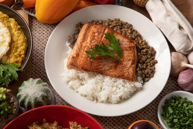 Photo lentils stew with fried fish and white rice monday meal