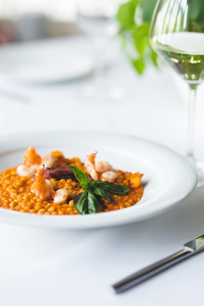 Lentils with octopus on a large white plate