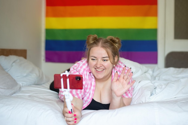 lesbian communicates via video link rainbow flag is an Lgbt concept bisexuality day