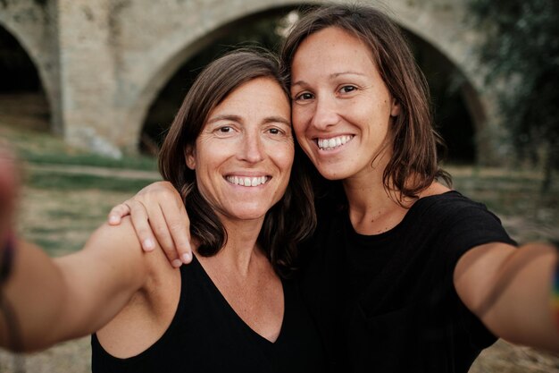 Lesbian couple taking a selfie together