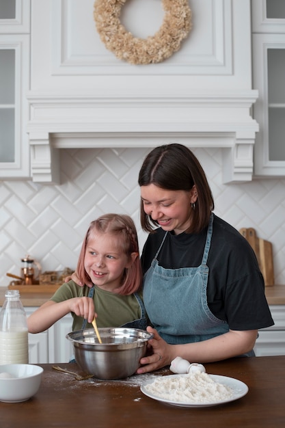 Lesbian woman cooking with her daughter