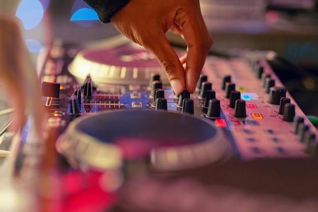 Lets get this party started Closeup shot of a DJ mixing music on a turntable