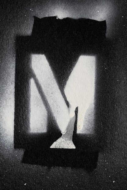 Photo letter m grunge spray paninted stencil font