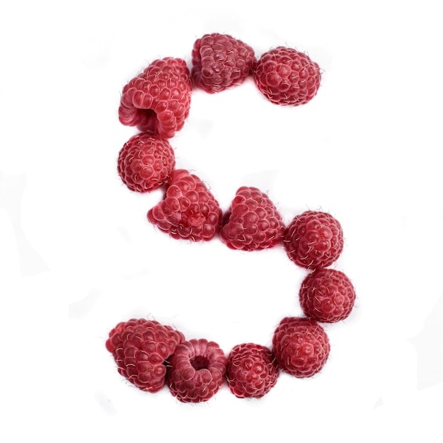 The letter S of the english alphabet of red ripe raspberries