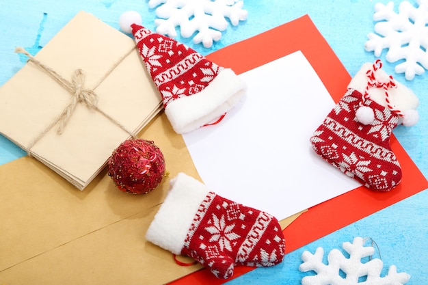 Letter to Santa Claus on wooden table close-up