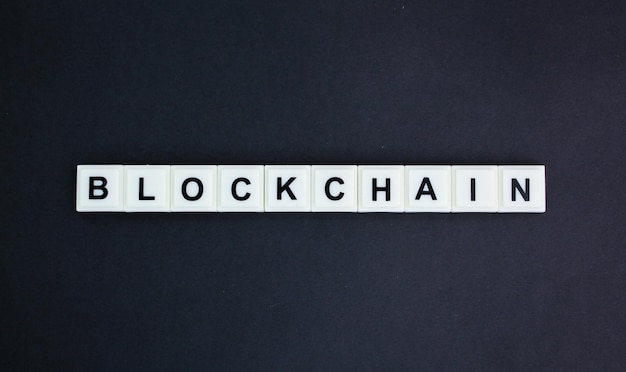 letters of the alphabet with the word blockchain concept of digital transfer or connection money