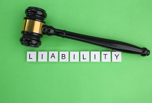 Photo letters of the alphabet with the word liability concept of liability the state of being legally