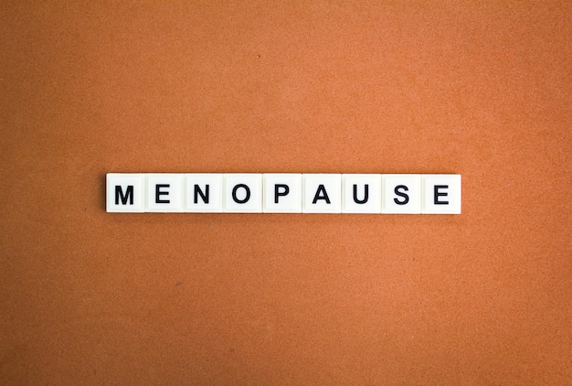 letters of the alphabet with the word Menopause the concept of women's disease health and medical