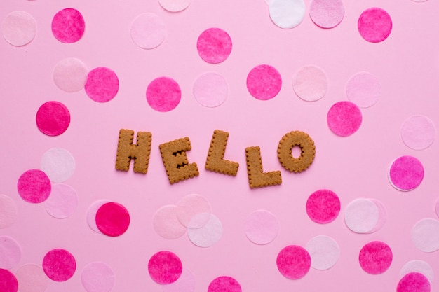 Letters cookies Hello with confetti on pink