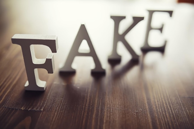 The letters spelled the word fake The concept of modern information technology Fake and facts in the news