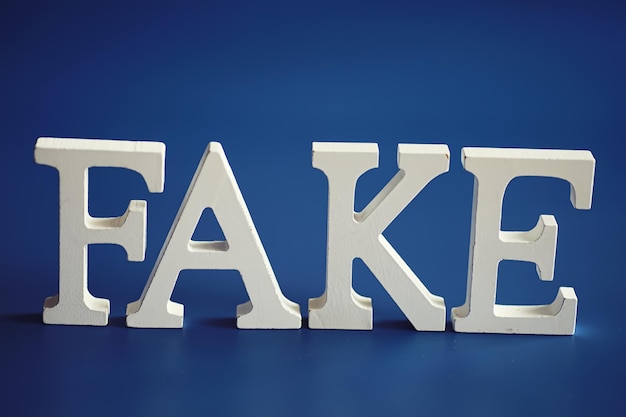 The letters spelled the word fake The concept of modern information technology Fake and facts in the news