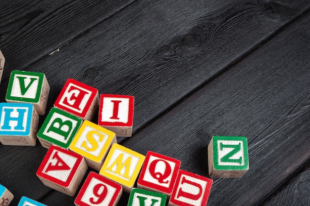 Letters. Wooden cubes with letters on wooden