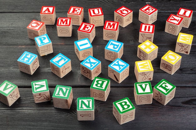 Letters. Wooden cubes with letters on wooden