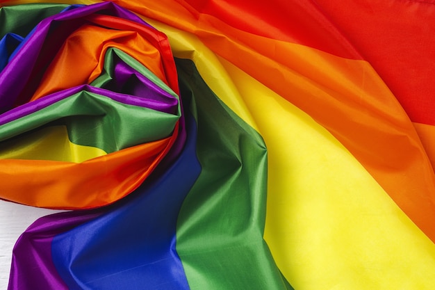 LGBT background flag with rainbow colored cardboard from above. Flat lay.