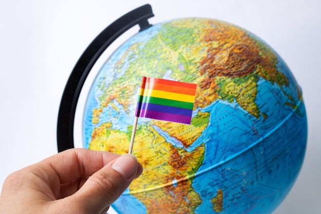 LGBT flag on a background of globe