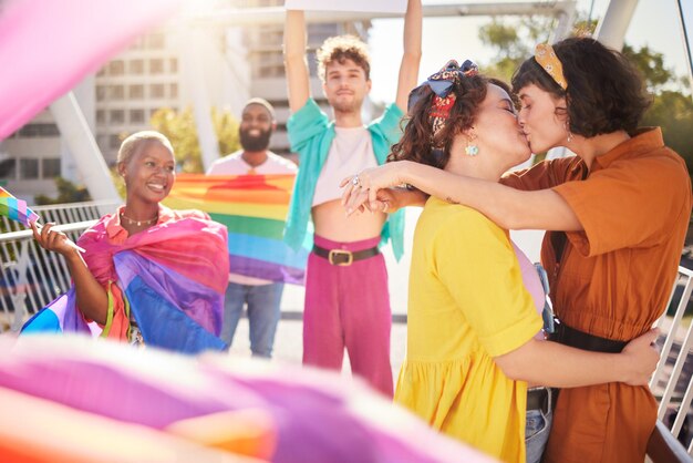 Photo lgbt kiss and couple of friends in city with rainbow flag for support queer celebration and relationship diversity lgbtq community and group of people enjoy freedom happiness and pride identity