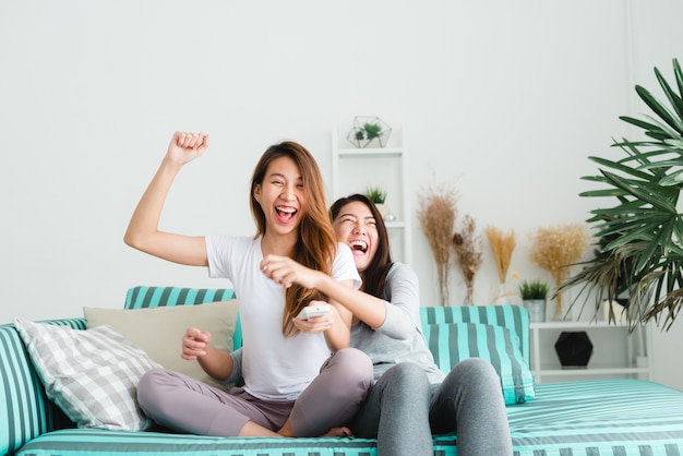 LGBT lesbian women couple moments happiness. Lesbian women couple together indoors concept