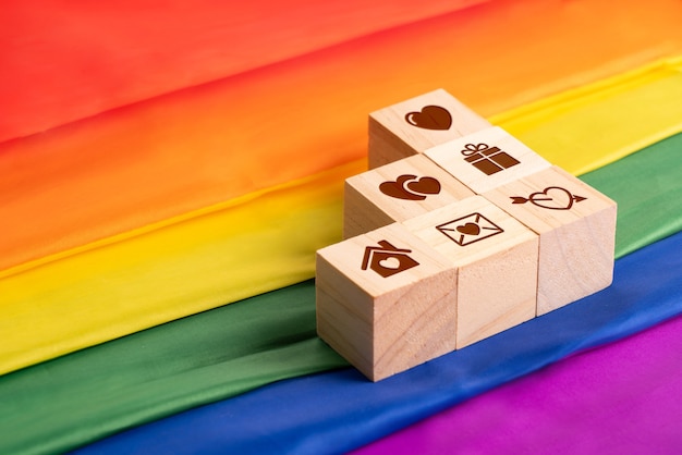 LGBTQ flag and symbol on table top view