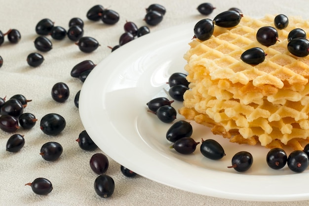 Liege waffles with berries on a napkin