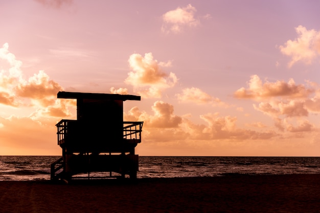 Life guard patrol hut silhouette in California during sunset