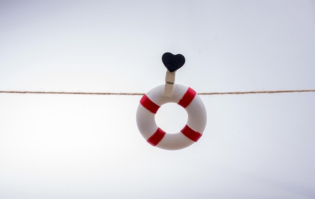 Life preserver attached to a string with heart