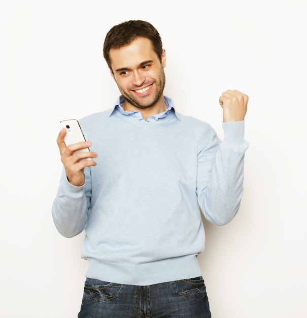 Life style, business and people concept: Young business man using mobile phone.Over white background.