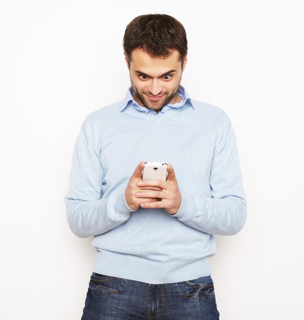 Life style, business  and people concept: Young business man using mobile phone.Over white background.