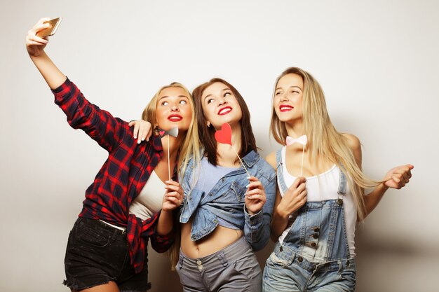 Life style, happiness, emotional and people concept: funny girls, ready for party, selfie