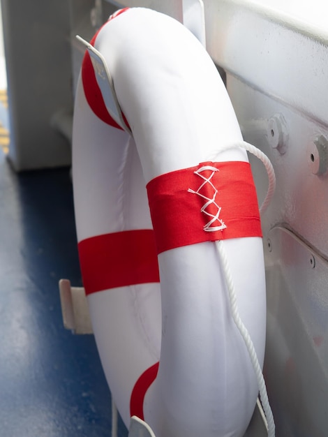 Lifebuoys for passengers on boarding ships are mounted on the side of the boat