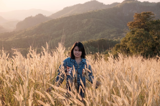 Lifestyle Beautiful women in a meadow and sunset light