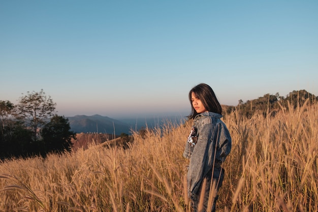 Lifestyle Beautiful women in a meadow and sunset light