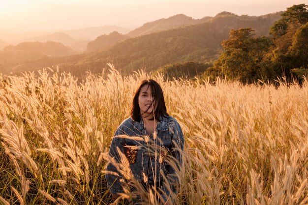 Lifestyle Beautiful  women in the meadow and the sunset light