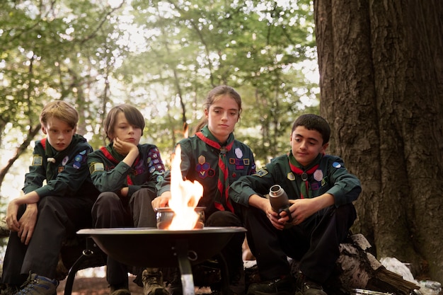 Photo lifestyle of  boy scouts in the woods