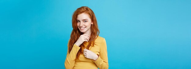 Photo lifestyle concept close up portrait young beautiful attractive ginger red hair girl playing with her