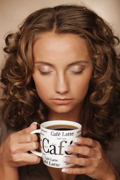 Lifestyle food and people concept young pretty woman drinking coffee