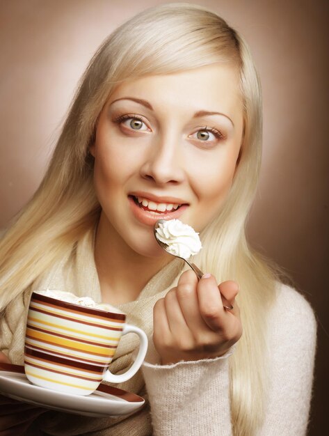 Lifestyle food and people concept young pretty woman drinking coffee