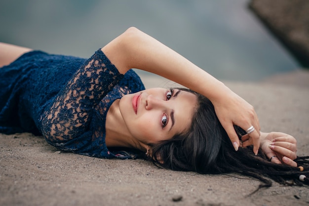 Lifestyle portrait of a woman brunette on of the lake