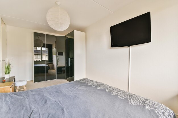 Light bedroom with wooden wardrobe