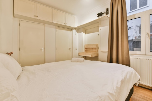 Light bedroom with wooden wardrobe