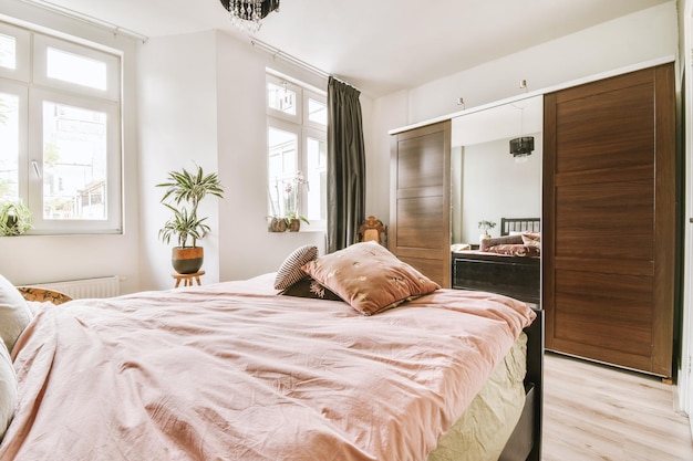 Light bedroom with wooden wardrobe