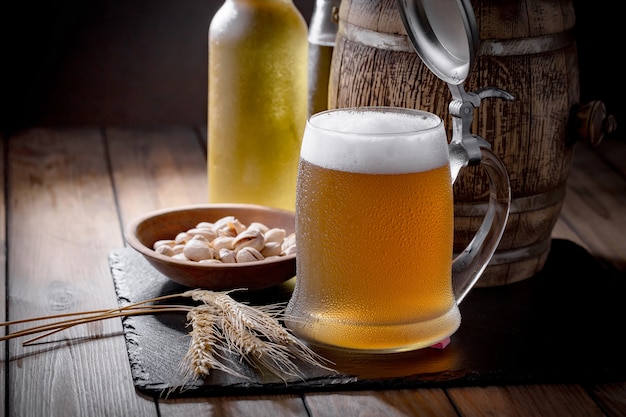 Light beer in a beer glass on an old background.