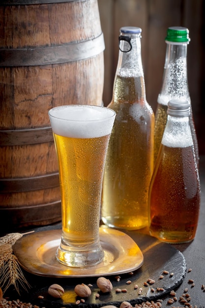 Light beer in a glass on an old background