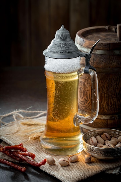 Light beer in a glass on an old background