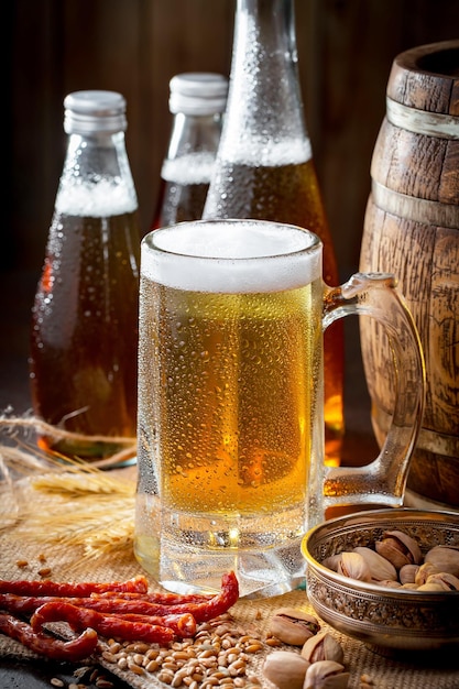 Light beer in a glass on an old background