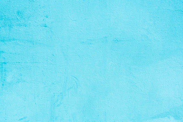 Light blue background of a roughly colored metal sheet