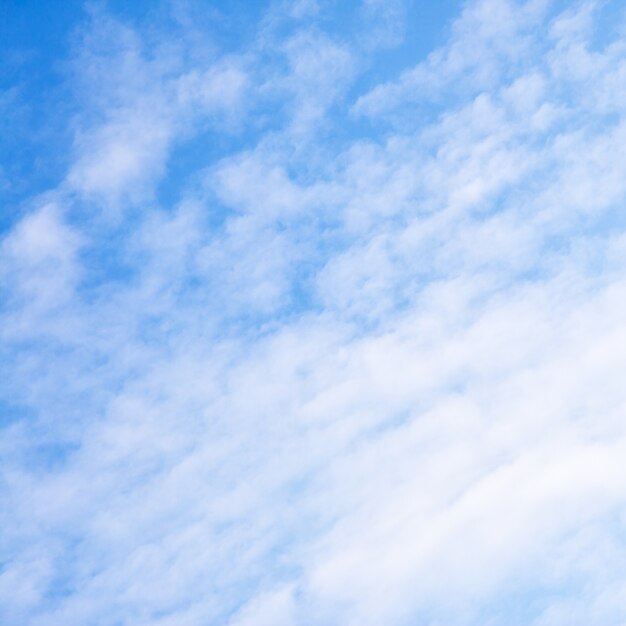 Light blue sky with clouds - background, space for your own text