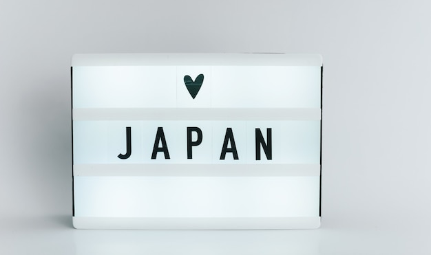 Light box with the headline JAPAN with copyspace, over white background