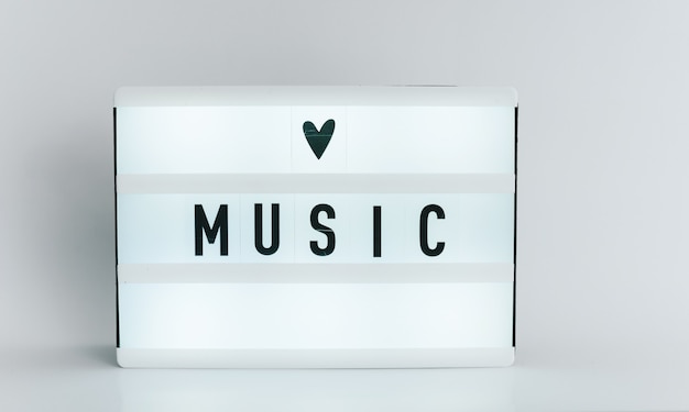 Light box with the headline MUSIC with copyspace, over white background