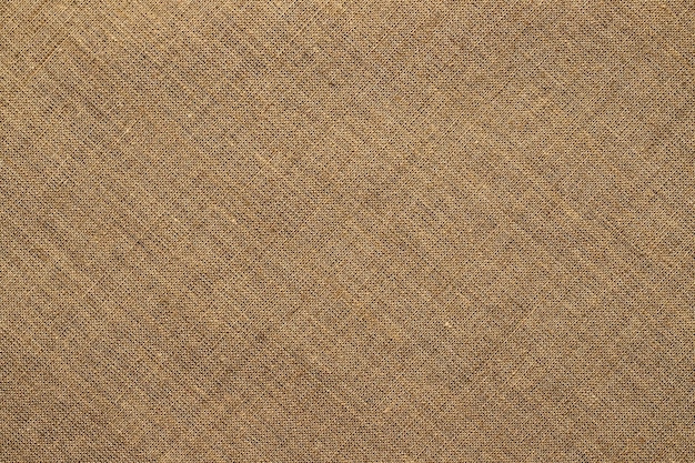 Light brown burlap fabric texture natural grunge background